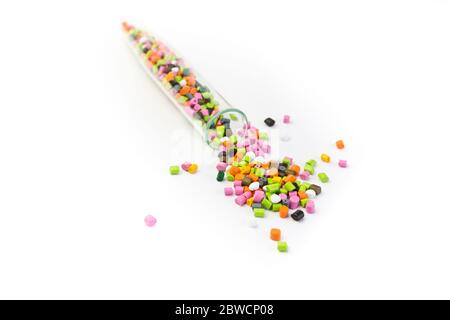 Plastic pellets .Multicolored Plastic granules. Plastic raw materials in granules for industry. Plastic granules after processing of waste polyethylen Stock Photo