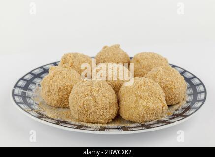 dumplings with plums on a plate, isolated on white Stock Photo