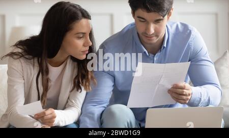 Young couple mange household finances at home Stock Photo