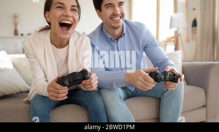 Excited couple have fun playing video games Stock Photo