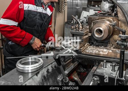 Master's hand. The old Metalworking machine, manufactured in the middle of the last century, is still in good condition. The use of old technologies i Stock Photo