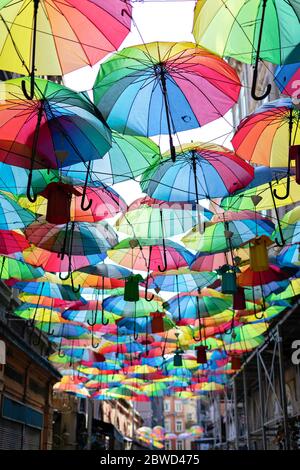 Background colorful rainbow different color umbrellas. unban tourist street decoration. Istanbul, Karakoy Stock Photo