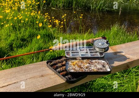 A traditional split cane fly fishing rod with an aluminium box of mayflies  Stock Photo - Alamy