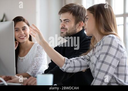 Smiling female male businesspeople working on project. Stock Photo
