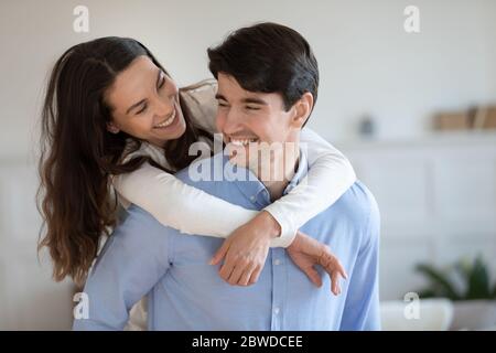 Happy young couple have fun at home Stock Photo