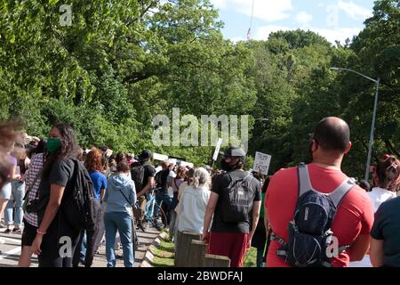 Protestors wearing face masks of U.S. President Barack Obama and ...