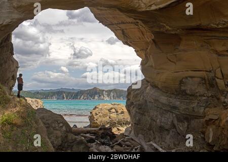 Hole in the Wall, along the Cooks Cove Walkway at Tolaga Bay Stock Photo