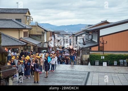 KYOTO, JAPAN - OCTOBER 18, 2019:  The view of  tourists shopping street Matsubara-Dori and group of japanese pupils that came with excursion for Kiyom Stock Photo