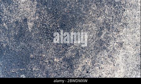 Panoramic background of worn concrete and asphalt, heavy industrial texture for creative copy space, horizontal aspect Stock Photo
