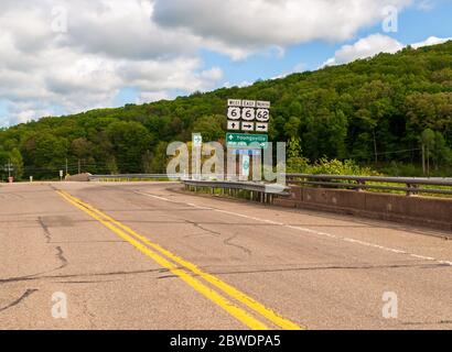 Road signs along US route 62 on a sunny spring day, Warren County, Pennsylvania, USA Stock Photo