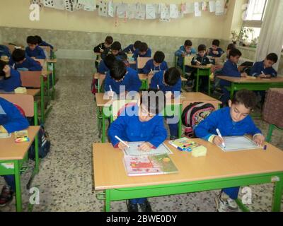 Elementary school boys  Gilan Iran. One of the primary school boys in Rasht, Guilan province, Iran.  Students are wearing school uniforms. Students ar Stock Photo