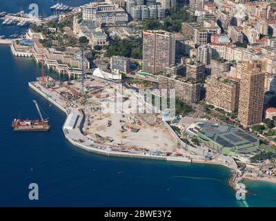 AERIAL VIEW. Mega construction site on reclaimed land, it will create the new ward of Portier Cove. Principality of Monaco. Stock Photo