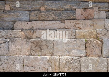 Marble blocks, natural stone wall background texture, white beige color, ancient greek marble, acropolis Parrthenon pedestal material closeup view Stock Photo