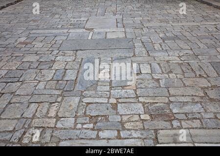 Marble stone paved street, texture background, high angle view. Athens, Greece. Cobblestone pathway to Acropolis, Athens Greece, perspective view Stock Photo