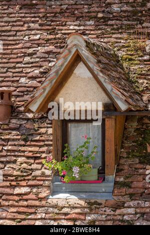 Old tiled roof of house in pilgrimage town of Rocamadour, Episcopal city and sanctuary of the Blessed Virgin Mary, Lot, Midi-Pyrenees, France Stock Photo