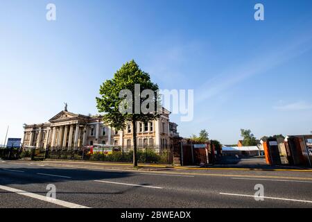 Northern Ireland Fire and Rescue Service firefighters tackling a large fire at Crumlin Road Courthouse in Belfast, Northern Ireland. Stock Photo