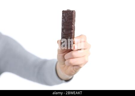 Close up of woman hand showing chocolate snack bar isolated on white background Stock Photo