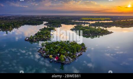 Budapest, Hungary - Aerial view of Lake Kavicsos (Kavicsos to) of Csepel district with small fishing islands on it. Fishing huts, piers and cabins on Stock Photo