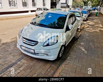 Typical small white car in Cape Town, South Africa. Stock Photo