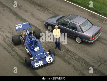 Jackie Stewart with some of his Grand Prix racing cars and a 1988 Ford Sierra Cosworth at Oulton Park 1988 Stock Photo