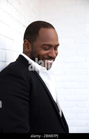 Handsome business man wearing suit and tie looking to side, relax profile  pose with natural face with confident smile. Stock Photo | Adobe Stock