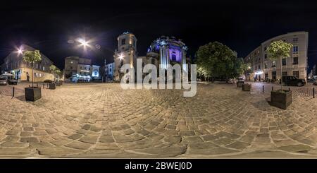 360 degree panoramic view of LVIV, UKRAINE - AUGUST 2019: Full spherical seamless night hdri panorama 360 degrees near old baroque uniate Dominican Cathedral in equirectangular pr