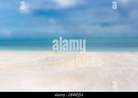 Beautiful beach with white sand, turquoise ocean water and blue sky with clouds in sunny day. Seascape abstract beach background. blur bokeh light Stock Photo