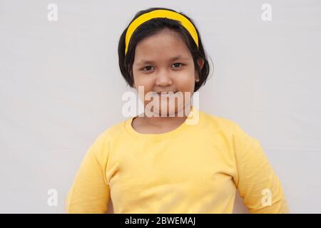 Close-up Boy putting coins into piggy bank Stock Photo