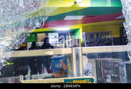 May 31, 2020, Boston, Massachusetts, USA: Looters inside a looted convenience store in Boston. Many stores in downtown Boston were looted following a rally against the death of George in Minneapolis police custody, in Boston. Credit: Aflo Co. Ltd./Alamy Live News Stock Photo