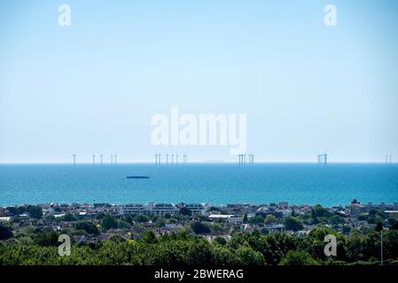 Brighton UK, 31st May 2020: The Rampion Wind Farm with Shoreham-by-Sea in the foreground Stock Photo