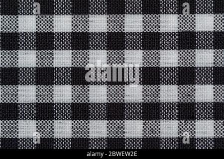 Checkered fabric background. Black cell. Top view, flat lay. Stock Photo