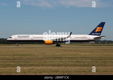 Icelandair Boeing 757-300 with registration TF-FIX rolling on taxiway V of Amsterdam Airport Schiphol.