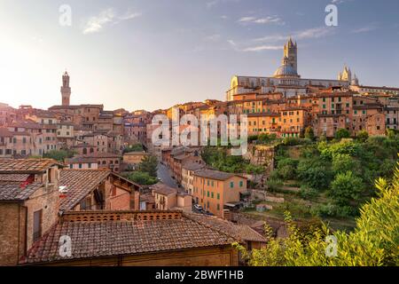 Siena. Aerial cityscape image of medieval city of Siena, Italy during sunset.