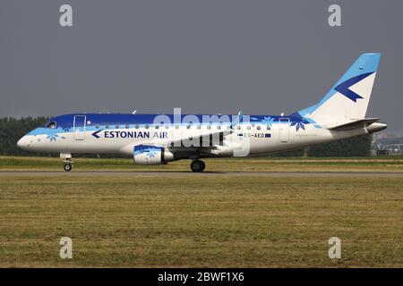 Estonian Air Embraer 170 with registration ES-AED rolling on taxiway V of Amsterdam Airport Schiphol. Stock Photo