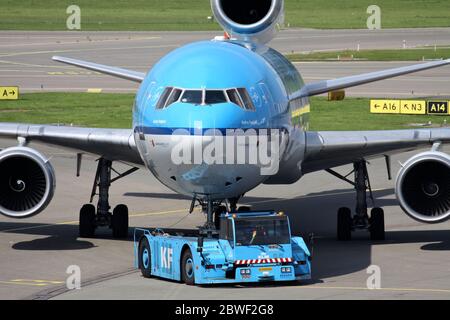 KLM McDonnell Douglas MD-11 with registration PH-KCE on pushback at Amsterdam Airport Schiphol. Stock Photo