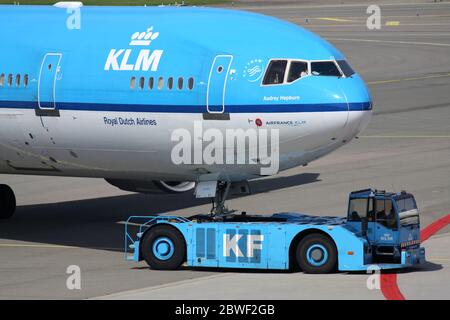 KLM McDonnell Douglas MD-11 with registration PH-KCE on pushback at Amsterdam Airport Schiphol. Stock Photo