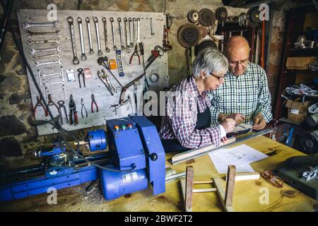 Senior couple in a carpentry Stock Photo