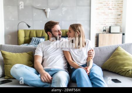 Couple at home relaxing in sofa Stock Photo