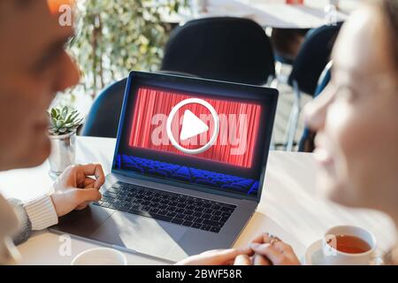 Couple watching movies on laptop Stock Photo - Alamy