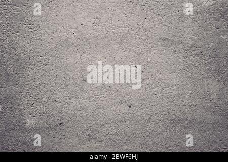 Texture of concrete and plaster on the wall. Wavy lines in the plaster. Texture of decorative plaster or stucco close up, abstract gray background Stock Photo