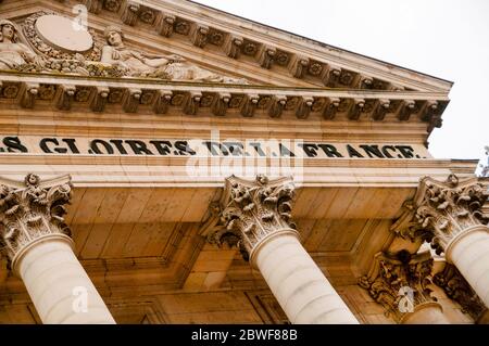 Corinthian columns and a Roman pediment entrance to Versailles in France. Stock Photo