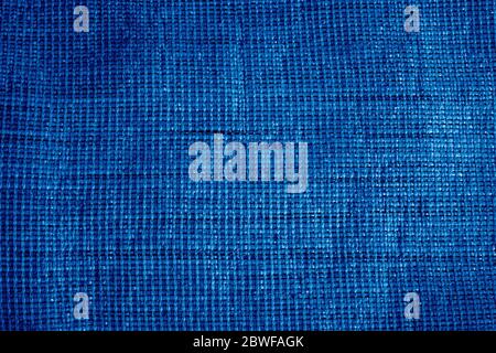 The texture of the rough fabric from the matting light brown color. Background. Trend color classic blue. Color of 2020. Main trend of the year. Blue Stock Photo