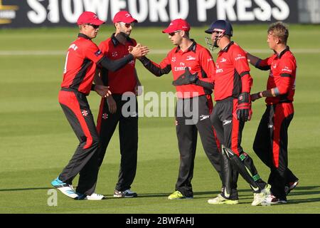 CHESTER LE STREET, ENGLAND - Mark Stoneman congratulates Keaton Jennings after he caught Kyle Coetzer in the deep during the Nat West T20 Blast North Division match between Durham and Northamptonshire at the Emirates Riverside, Chester le Street on Friday 24th July 2014 (Credit: Mark Fletcher | MI News) Stock Photo