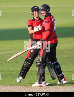 CHESTER LE STREET, ENGLAND - Calum McLeod and John Hastings of Durham celebrate after their unbroke partneship secured a five wicket win in the Nat West T20 Blast North Division match between Durham and Northamptonshire at the Emirates Riverside, Chester le Street on Friday 24th July 2014 (Credit: Mark Fletcher | MI News) Stock Photo