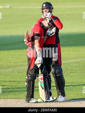 CHESTER LE STREET, ENGLAND - Calum McLeod and John Hastings of Durham celebrate after their unbroke partneship secured a five wicket win in the Nat West T20 Blast North Division match between Durham and Northamptonshire at the Emirates Riverside, Chester le Street on Friday 24th July 2014 (Credit: Mark Fletcher | MI News) Stock Photo