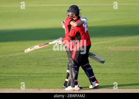 CHESTER LE STREET, ENGLAND - Calum McLeod and John Hastings of Durham celebrate after their unbroke partneship secured a five wicket win in the Nat West T20 Blast North Division match between Durham and Northamptonshire at the Emirates Riverside, Chester le Street on Friday 24th July 2014 (Credit: Mark Fletcher | MI News) Stock Photo