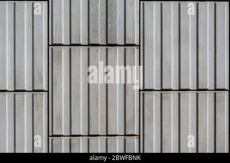 A close up crop of stacked concrete cinder blocks used in construction make an abstract background. Stock Photo