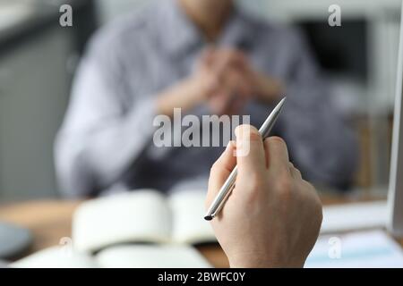 Focused photo on male hand that holding pen Stock Photo