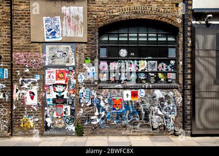 Brown brick wall covered with graffiti showing the word Bronx, Munich ...