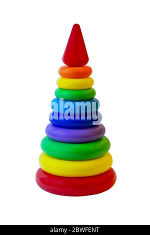 Children's plastic toy pyramid in a packing grid on a white background. Children's activity game for learning colors and shapes. Stock Photo